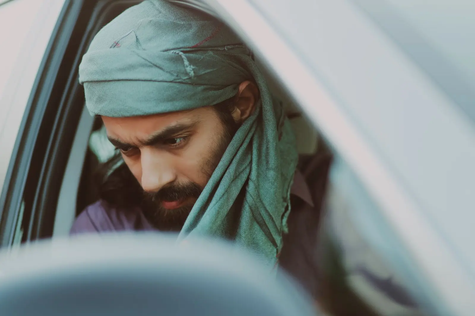A man sitting at the wheel of a car in Punjab