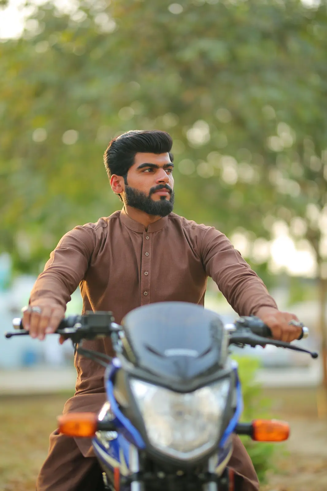 A man riding a motorcycle in Lahore